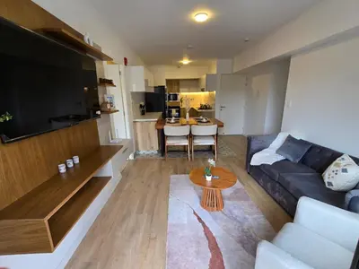 a living room with a couch and a table at Apartamento full equipado en barranco in Lima