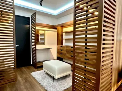 a dressing room with a white stool and a desk at Deluxe Apartment in San Isidro in Lima