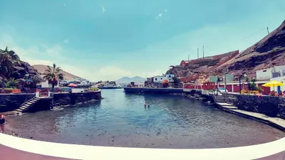 a view of a river with buildings and a town at Ninfas 371 in Pucusana