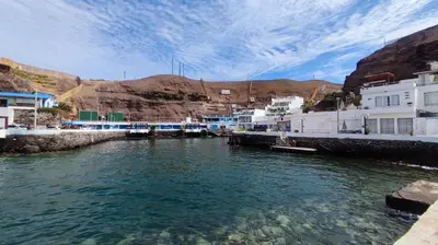 a view of a body of water with buildings at Ninfas 371 in Pucusana