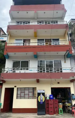 a building with a sign in front of it at Apartamento La Merced in La Merced