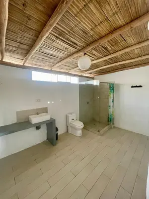 a bathroom with a toilet and a sink and a shower at Bungalows frente al mar en playa Wakama in San Vicente de Cañete