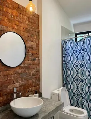 a bathroom with a sink and a mirror and a toilet at Casa Tullpa in Aspitia