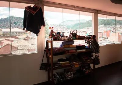 a bedroom with a bunk bed and a window at INKALAM cusco in Cusco