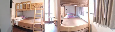 a room with two bunk beds and a window at Temazcal Hostel in Lima