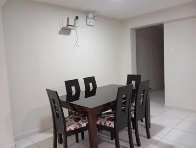 a dining room with a table and chairs at La campiña in Lima