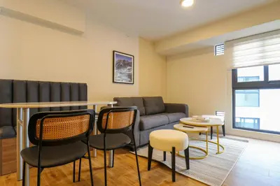 a living room with a couch and a table and chairs at Moreyra by Wynwood House in Lima