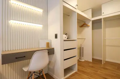 a closet with a desk and a chair in a room at Moreyra by Wynwood House in Lima