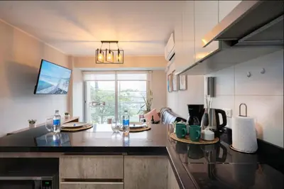 a kitchen with a black counter top in a room at Stelar Apartments by Vibrant in Lima