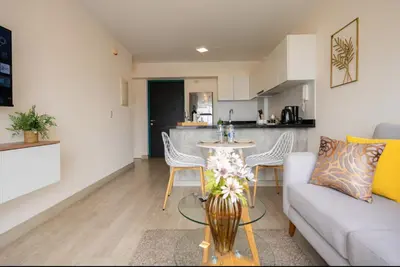 a living room with a couch and a table at Stelar Apartments by Vibrant in Lima