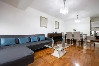 a living room with a couch and a table at Nogales Family Apartments by Vibrant in Lima