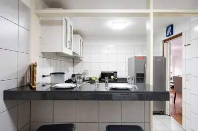 a kitchen with a counter with two plates on it at Nogales Family Apartments by Vibrant in Lima