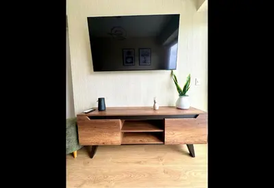 a wooden desk with a mirror on a wall at Apartamento Céntrico cerca a San Isidro in Lima