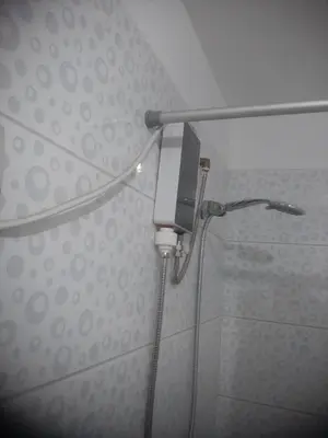 a shower in a bathroom with a shower head at Microdepartamento amoblado in Lima
