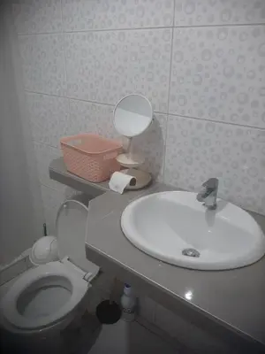 a bathroom with a sink and a toilet at Microdepartamento amoblado in Lima