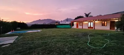 a house with a yard with a swimming pool at Casa pachacamac in Pachacamac