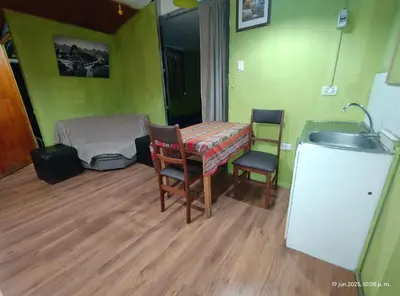 a room with a sink and a table and chairs at IG Art in Cusco