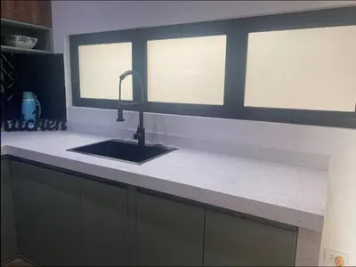 a kitchen counter with a sink and a window at Apartamentos como en casa in Chancay