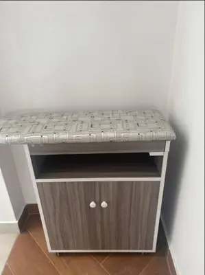 a wooden bench with a mattress on top of it at Apartamentos como en casa in Chancay