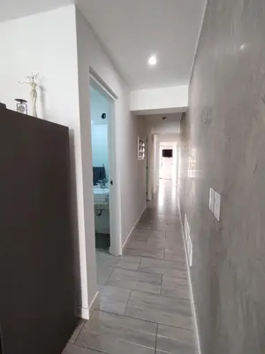a hallway with a tile floor in a house at Depa en Punta Hermosa in Punta Hermosa
