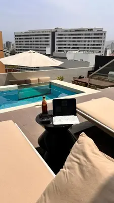 a laptop sitting on a table on top of a building at Lima Limón in Lima