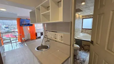 a bathroom with a sink and a toilet in it at Hotel Cusco Museo in Cusco