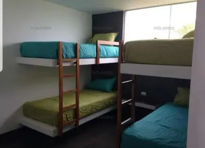 a room with three bunk beds and a window at Casa en Asia in Asia