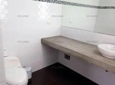 a white bathroom with a sink and a toilet at Casa en Asia in Asia