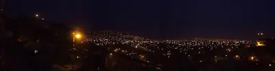 a view of a city at night with lights at A great experience in the South cone of Lima! in Lima