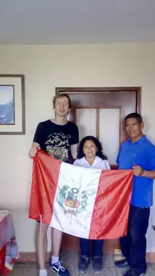 two men and a woman holding a flag at A great experience in the South cone of Lima! in Lima