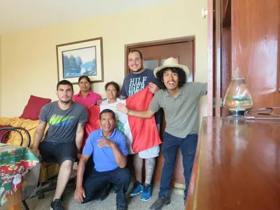 a group of people posing for a picture in a room at A great experience in the South cone of Lima! in Lima