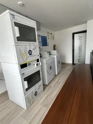 a laundry room with four washers and dryers in it at Modern 2Br Apt Fully Furnished Barranco in Lima