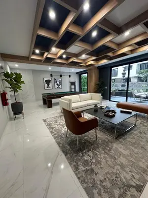 a living room with a couch and a table at Departamento amoblado de 1 dormitorio in Lima