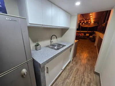 a kitchen with a sink and a counter top at Miramar Vip in Barranca