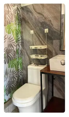 a bathroom with a toilet and a sink at Cabaña2 con hermosa vista al valle in Oxapampa