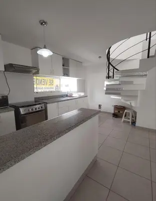 a kitchen with a counter top and a stove at Duplex con piscina en Asia in Asia