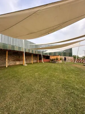 a person walking under a large building with awning at Mirador 101 in Asia