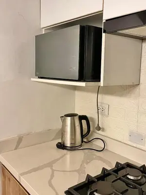 a tea kettle is sitting on a kitchen counter at Entire House close to the sea Miraflores in Lima