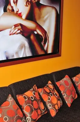 a picture of a woman on the wall with pillows at Temporal Apartment in Lima