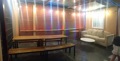 a living room with a couch and a table at Sweet Rustic Home in Hacienda Santo Domingo