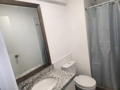 a bathroom with a sink and a toilet and a shower at Apartamento en Lima in Lima
