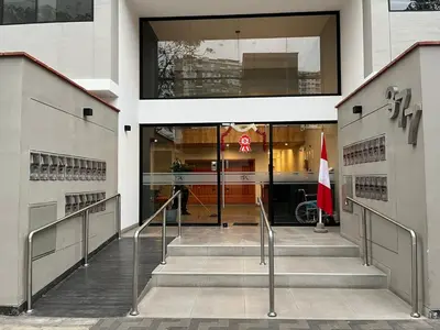 a staircase leading to a building with a flag at Luxury Barranco Pool Zoe in Lima