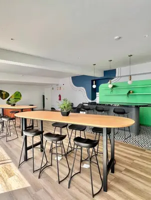 a cafeteria with tables and chairs and a pool table at Luxury Barranco Pool Zoe in Lima