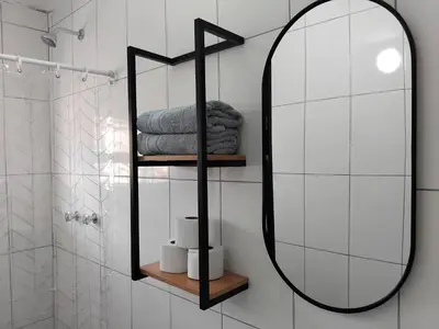 a bathroom with a mirror and a shower at Apartment in the historic center of Cusco in Cusco