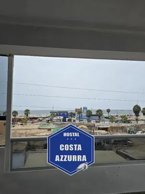 a blue sign that reads hospital costa navarino at Hostal COSTA AZZURRA in Cerro Azul