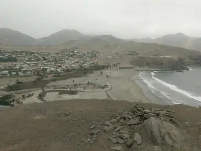 a group of people walking on a beach next to the ocean at Relaxing Bungalow in Santa Rosa