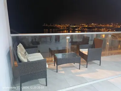 a balcony with chairs and a table with a view at Mirador sur in San Bartolo