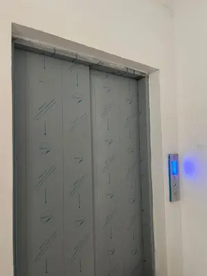 two metal lockers in a room with a blue light at Mirador sur in San Bartolo