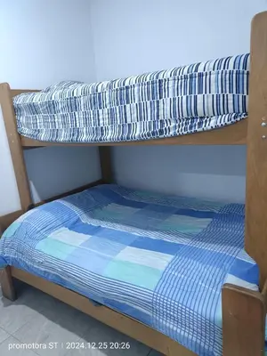 a bunk bed with a pillow on top of it at departamento frente al mar in San Bartolo