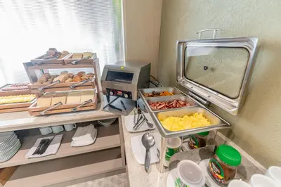 a room with a counter with food and a mirror at Hotel Límade in Lima